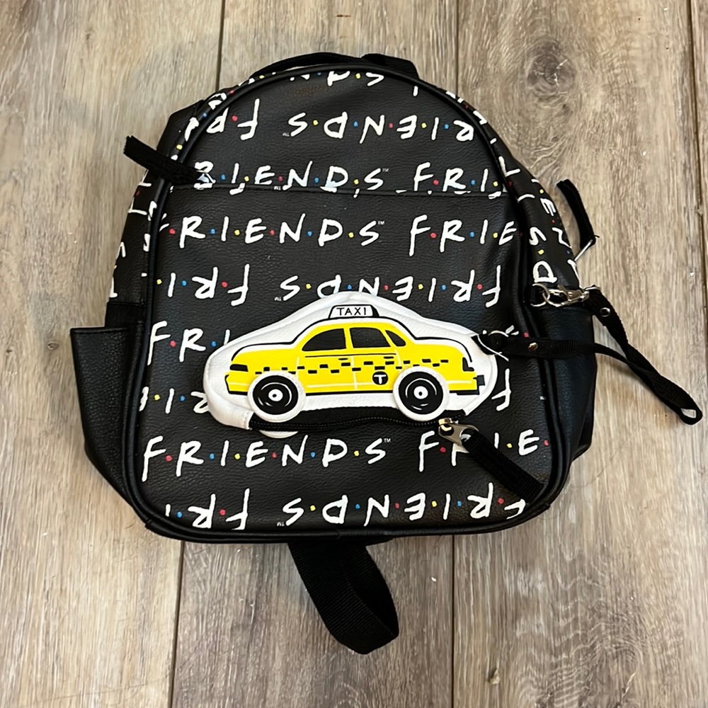 Black friends mini backpack two pockets on the backpack and one in little pouch